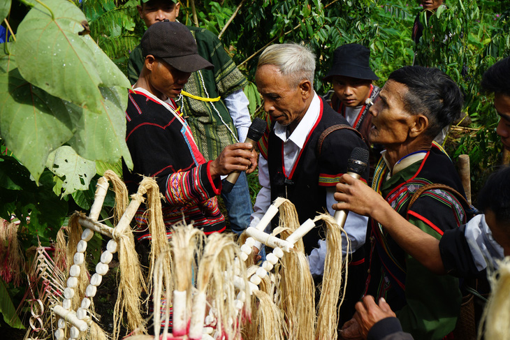 Village elders read prayers at the Water Trough Worshiping Ceremony - Photo: PT