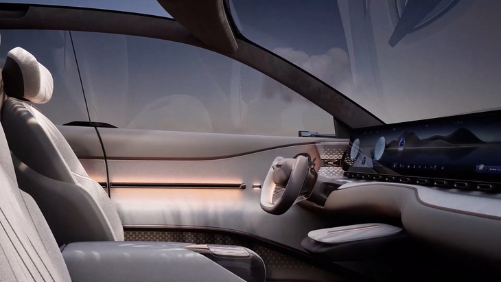 Mẫu xe điện Skyworth Skyhome gây sốc, giá dự kiến như Mazda CX-5- Ảnh 6. Bảng điều khiển đặt một màn hình cong lớn tích hợp cả cụm đồng hồ, thông tin giải trí và màn hình cho người ngồi ghế phụ. Vô lăng dạng ách giống Tesla, song được bo tròn mềm mại. Hệ thống chiếu sáng cabin phức tạp tạo nên nhiều góc độ ánh sáng khác biệt