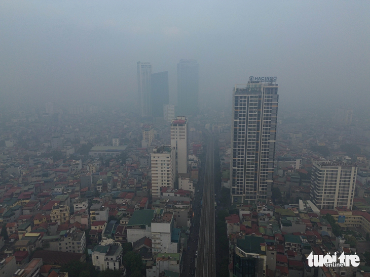 Bầu trời Hà Nội mù đặc, ô nhiễm không khí tệ thứ 2 thế giới- Ảnh 11.