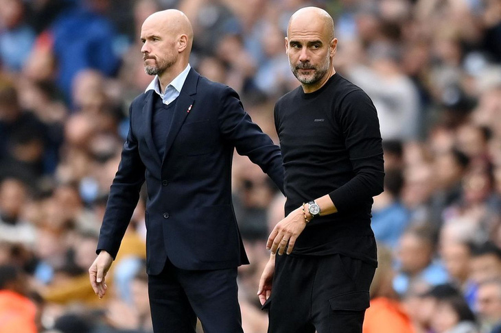 HLV Erik Ten Hag (trái) không ngại Guardiola - Ảnh: REUTERS