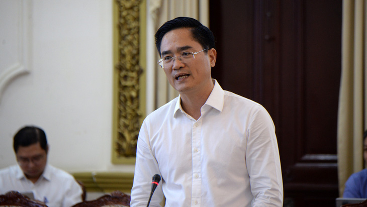 Giám đốc Sở Giao thông vận tải TP.HCM Trần Quang Lâm báo cáo tại hội nghị - Ảnh: H.K.