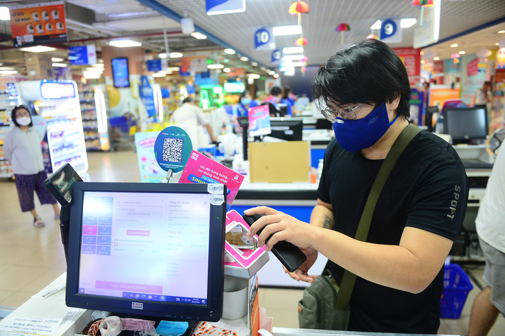 Hình thức thanh toán qua ví MoMo đã rất phổ biến tại hệ thống siêu thị của Saigon Co.op - Ảnh: QUANG ĐỊNH