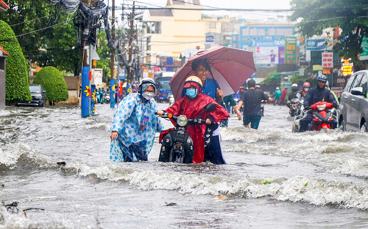 Áp thấp nhiệt đới ngoài khơi Philippines mạnh lên thành bão Trami - Ảnh 3.