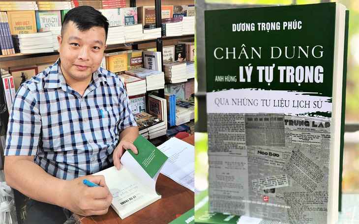 Tác giả Dương Trọng Phúc ký tặng sách cho bạn đọc đặt mua và cuốn sách Chân dung anh hùng Lý Tự Trọng qua những tư liệu lịch sử - Ảnh: HỒNG ANH
