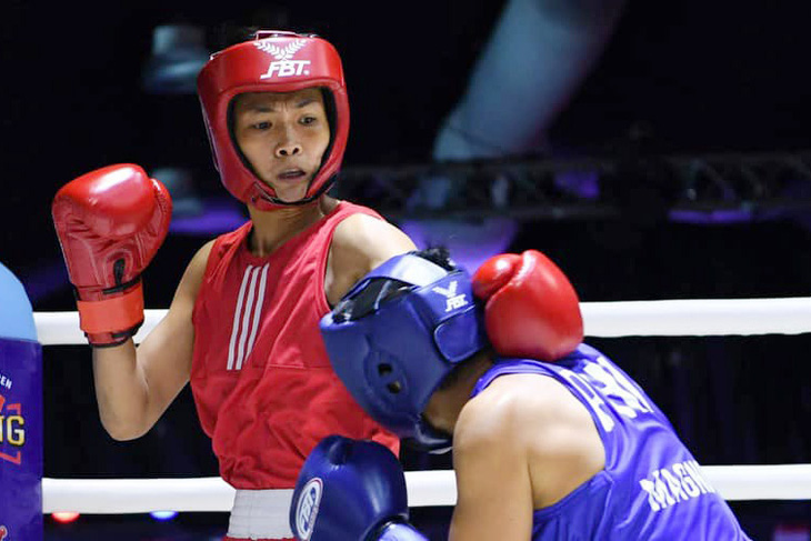 Sau Nguyễn Thị Tâm ở Tokyo 2020, Võ Thị Kim Ánh (giáp đỏ) là nữ võ sĩ Việt Nam thứ 2 giành vé dự Olympic - Ảnh: ABF