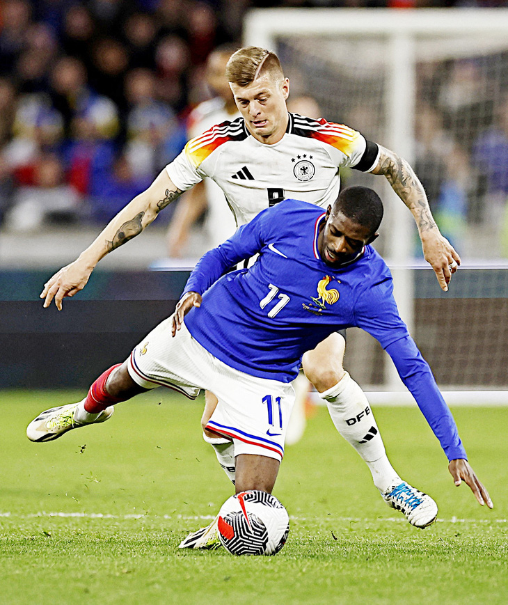 Kroos (8) là mảnh ghép quan trọng mà tuyển Đức cần tại Euro 2024 - Ảnh: Reuters
