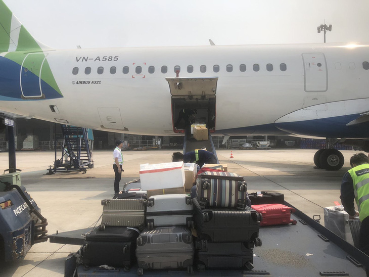 Hành lý lên máy bay của Bamboo Airways tại Nội Bài do Pacific Airlines phục vụ - Ảnh: PA