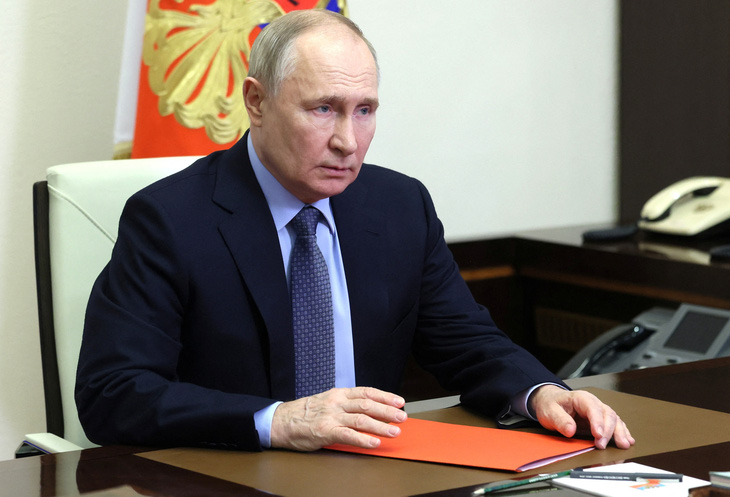 Tổng thống Nga Vladimir Putin tại một cuộc họp ở ngoại ô thủ đô Matxcơva hôm 29-3 - Ảnh: REUTERS