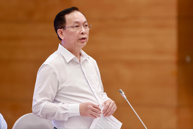 Phó thống đốc Ngân hàng Nhà nước Đào Minh Tú trả lời câu hỏi liên quan vụ khách hàng gửi tiền tại Ngân hàng MSB và bị mất - Ảnh: NGUYỄN KHÁNH