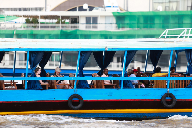Ngồi tàu máy, đi xe điện khám phá cù lao ven sông Mekong- Ảnh 2.