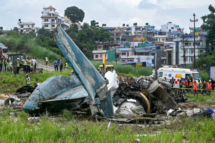 Hiện trường vụ rơi máy bay tại Nepal ngày 24-7 - Ảnh: AFP