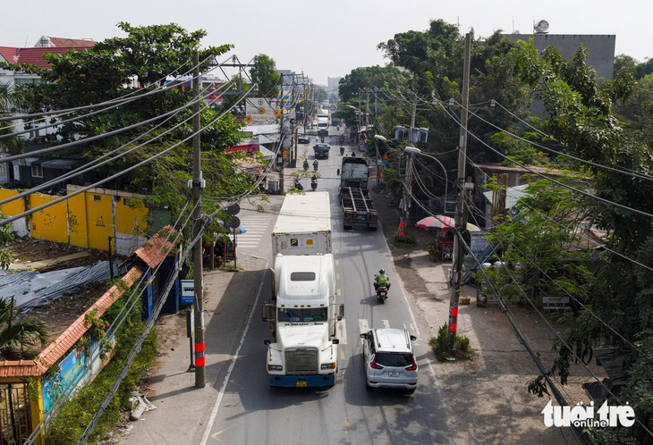 Vốn mở rộng đường Nguyễn Duy Trinh tăng do phí giải phóng mặt bằng - Ảnh 2.