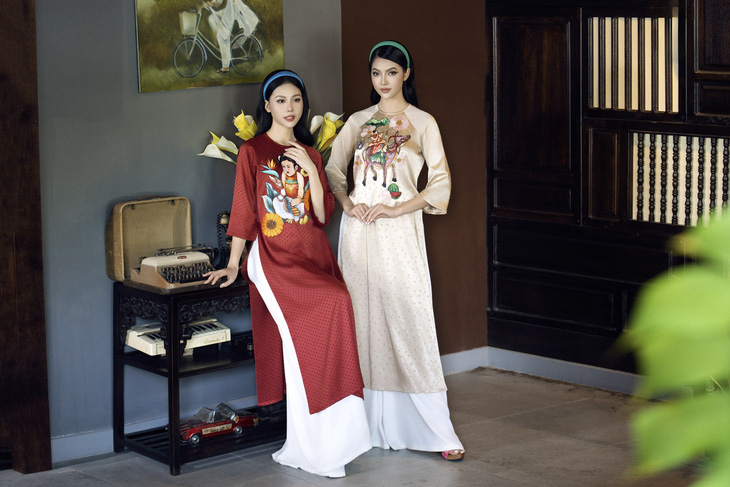 ao-dai-lua-theu-tay-tranh-dong-ho