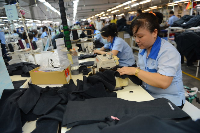 Sản xuất hàng dệt may xuất khẩu sang thị trường Mỹ và EU (châu Âu) tại Công ty cổ phần SXTM May Sài Gòn (Garmex Saigon JS). Ảnh: QUANG ĐỊNH