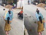 Hai cô gái cầm tấm bạt to tổ chảng hứng mít vẫn hụt