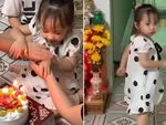 Bé gái giận dỗi vì cả nhà không cho thổi nến bánh gato của anh trai