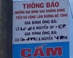 Không đóng tiền làm đường trong xóm, hai gia đình bị người dân bêu tên lên trụ điện
