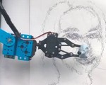 Robot đầu tiên thế giới có thể nhìn và vẽ chân dung người