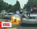 Bị bắt vì phóng ôtô có trẻ em đu bám bên ngoài