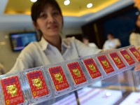 Giá vàng, USD tăng vọt sau khi chiến tranh thương mại Mỹ - Trung tăng nhiệt
