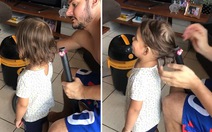 Bố cột tóc cho con gái bằng máy hút bụi