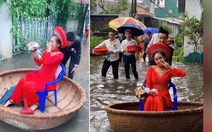 Chú rể đẩy thuyền thúng rước cô dâu về dinh trong ngày mưa lụt