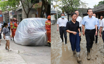 Lũ ngập Trùng Khánh, xe hơi bị 'gói' trong bao nhựa