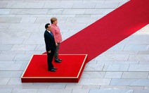 ​Bà Merkel gặp khó giữa Mỹ và Trung Quốc