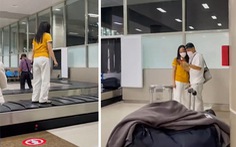 Cô gái mặc áo vàng quần trắng 'sống ảo' trên băng chuyền hành lý