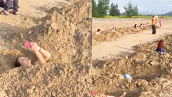 Video: Du khách đào hàng chục hố cát ở bãi biển Cửa Lò để thiền, hình ảnh làm 'dậy sóng' trên mạng