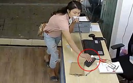 Cô gái dùng mũ che mũi để lộ mặt đi trộm iPhone