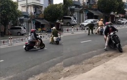 Đôi nam nữ quay đầu xe Vespa chạy trốn CSGT khi bị tuýt còi