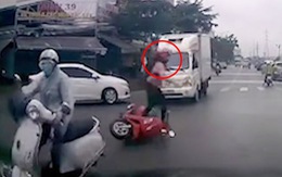 Cô gái nhanh chân nhảy khỏi xe máy sau va chạm giao thông