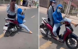 Cô gái chạy xe máy 'làm xiếc' trên phố, hết ngồi bệt lại vắt chân