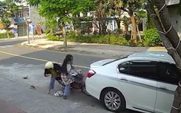Nữ sinh chạy xe không nhìn đường tông móp đuôi ôtô