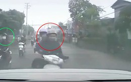 Vỗ mông cô gái đi xe tay ga, hai thanh niên tông vào ôtô