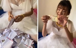Cô dâu bóc phong bì mỏi tay và nhận được món quà bất ngờ của em gái