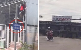 'Xe 2 bánh được phép đi thẳng khi đèn đỏ' và trước mặt là trại hòm