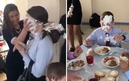 Cậu bé ngơ ngác vì lãnh trọn bánh kem sinh nhật của nữ sinh