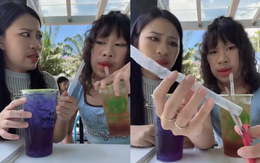 Hai cô gái hướng dẫn cách uống nước siêu cồng kềnh