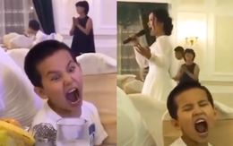Biểu cảm hài hước của bé trai khi nhại theo mẹ hát opera ở đám cưới