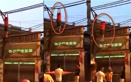 Video thanh niên đu dây điện toòng teng ở Hà Nội
