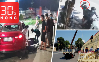 Bản tin 30s Nóng: Bị giật điện thoại khi xem tin nhắn; Ô tô kéo lê xe máy; Dỡ lan can như 'hàng rào nhà tù'