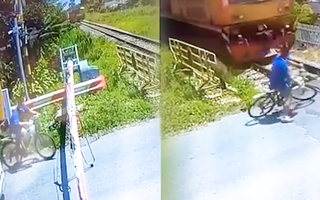 Video: Lên án người đàn ông phóng xe qua đường ray khi đoàn tàu đang tới