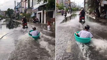 Nam sinh dùng chậu lướt trên đường ngập ở Cà Mau