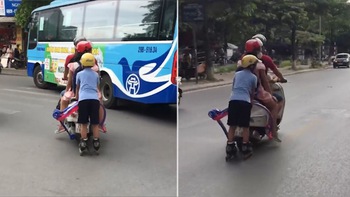 Người đàn ông chở 2 con nhỏ kéo theo bé trai trượt pa-tin giữa đường khiến người xem không khỏi sợ hãi