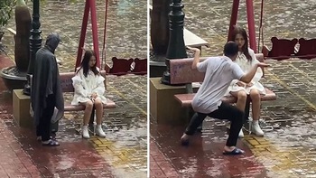 Chàng trai làm trò dỗ dành bạn gái giận dỗi dưới mưa