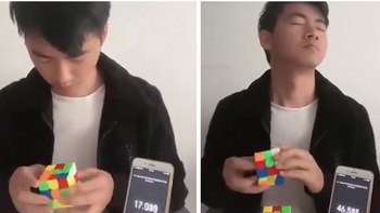 Chàng trai nhắm mắt biểu diễn xoay 2 khối rubik giống nhau