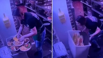 Nữ nhân viên hờn trách bản thân khi làm đổ đĩa thức ăn vào thùng