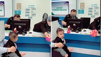 Cảnh sát dùng đồ chơi để dụ bé trai chụp ảnh làm hộ chiếu